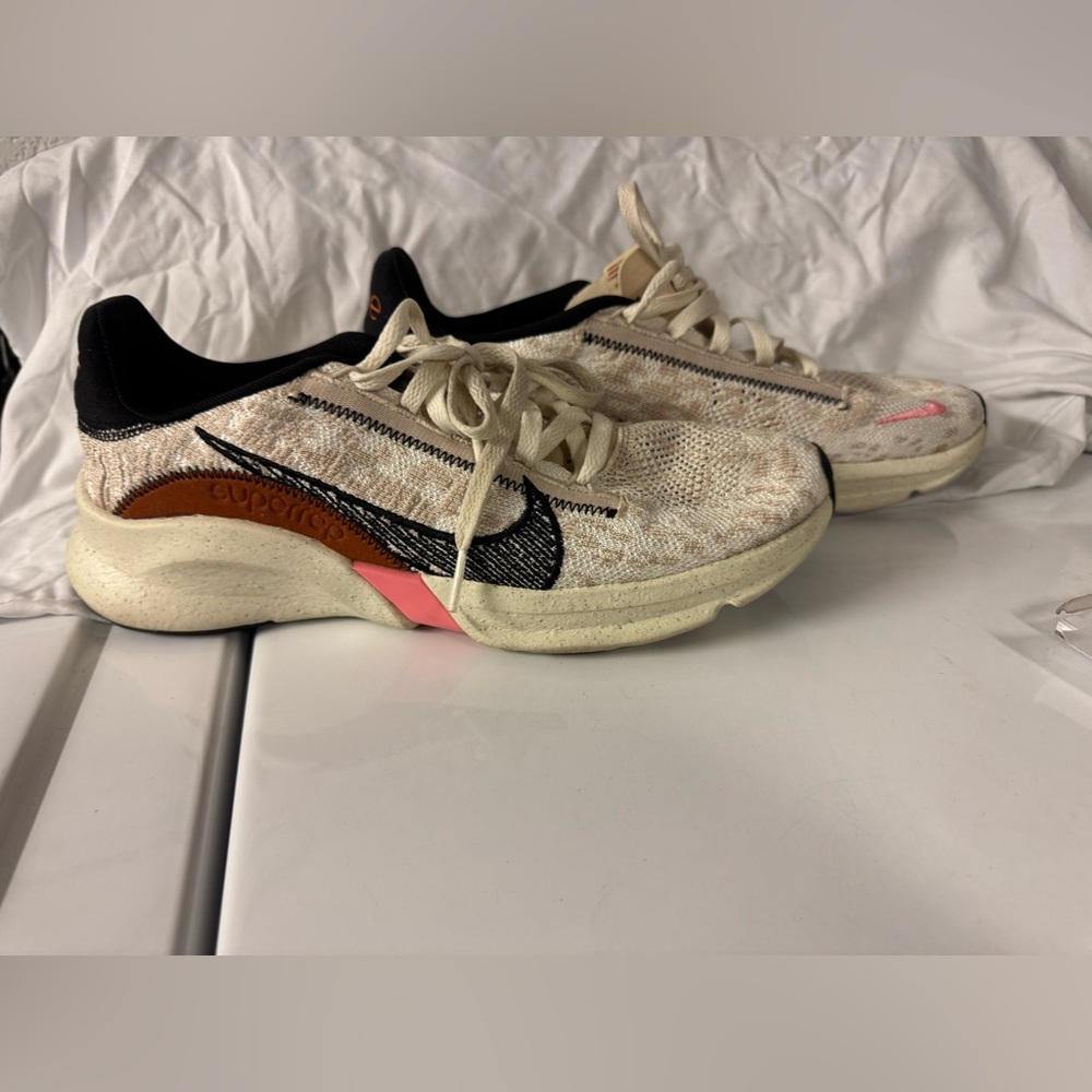 Nike Cream and Black Sneakers with Sleek Design